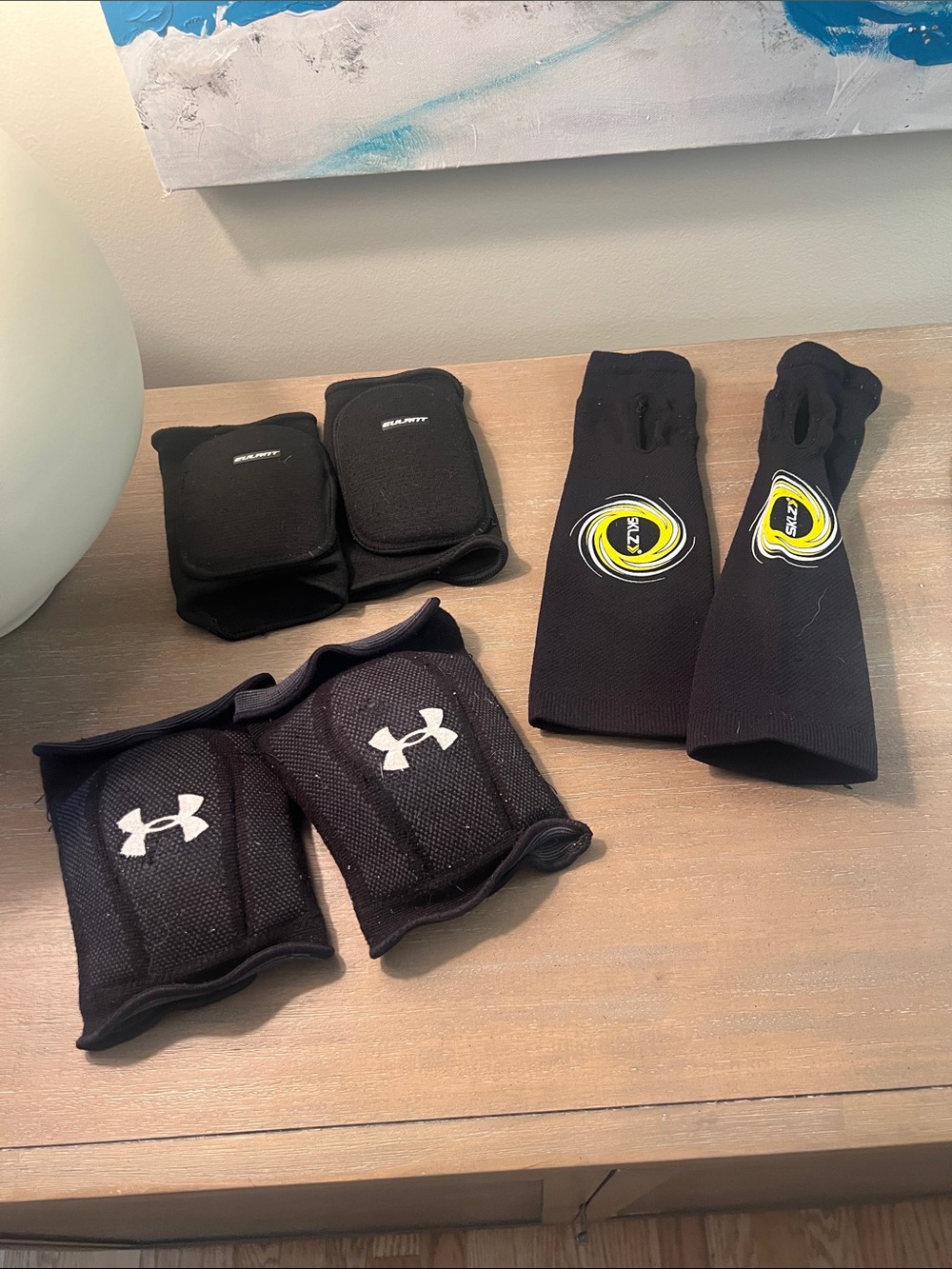 Under Armour Black Wrist and Sleeve Guards with Yellow Logo Accents volleyball